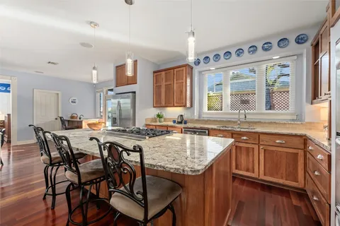 a kitchen with a stove and a sink