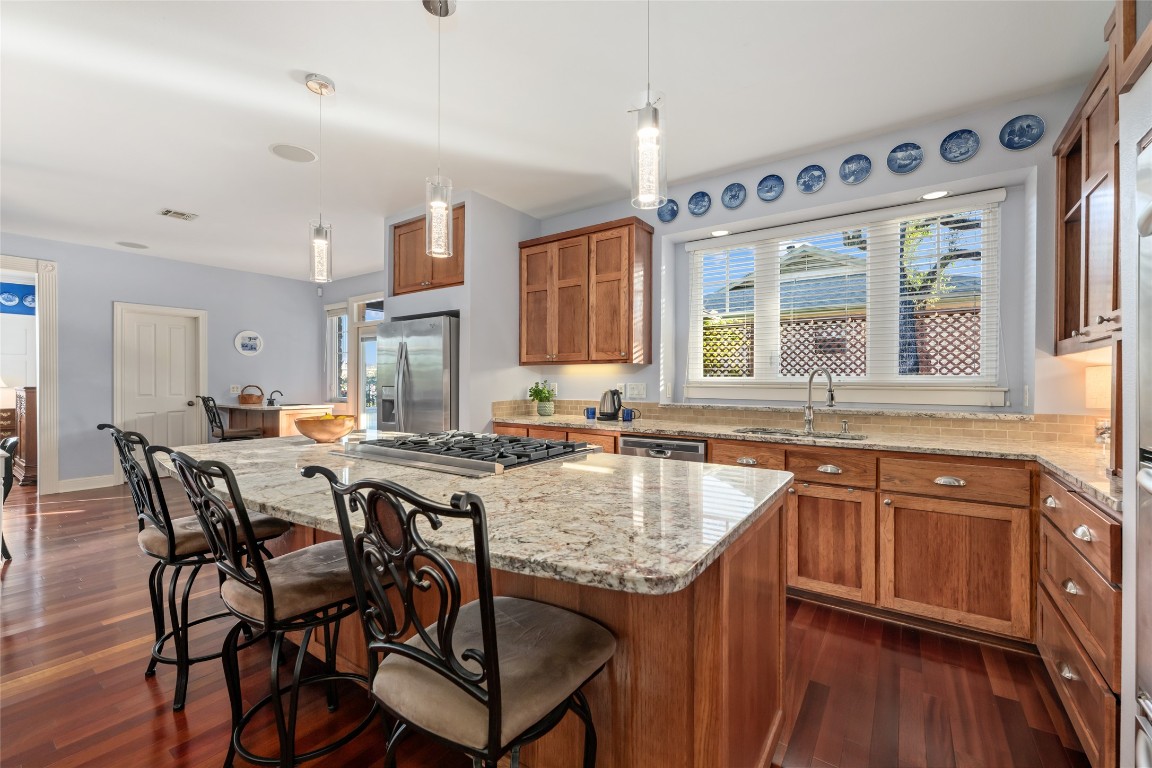 20403 Highland Lake Drive Lago Vista, TX 78645 - Photo 11 of 40 a kitchen with granite countertop a sink and wooden floor