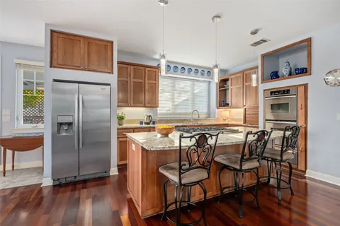 a kitchen with a stove and a sink