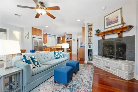 a bedroom with furniture and wooden floor