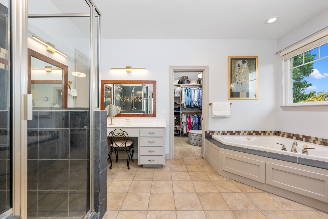20403 Highland Lake Drive Lago Vista, TX 78645 - Photo 21 of 40 a bathroom with a bathtub and a sink