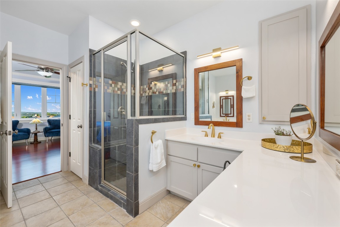 20403 Highland Lake Drive Lago Vista, TX 78645 - Photo 23 of 40 a bathroom with a tub sink and mirror