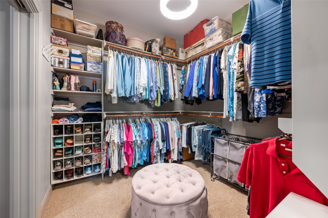 20403 Highland Lake Drive Lago Vista, TX 78645 - Photo 24 of 40 a view of walk in closet with clothes and shoes