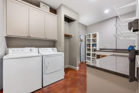 a kitchen that has a table and chairs in it