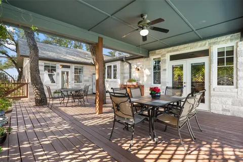 a view of a swimming pool with an outdoor seating and a yard