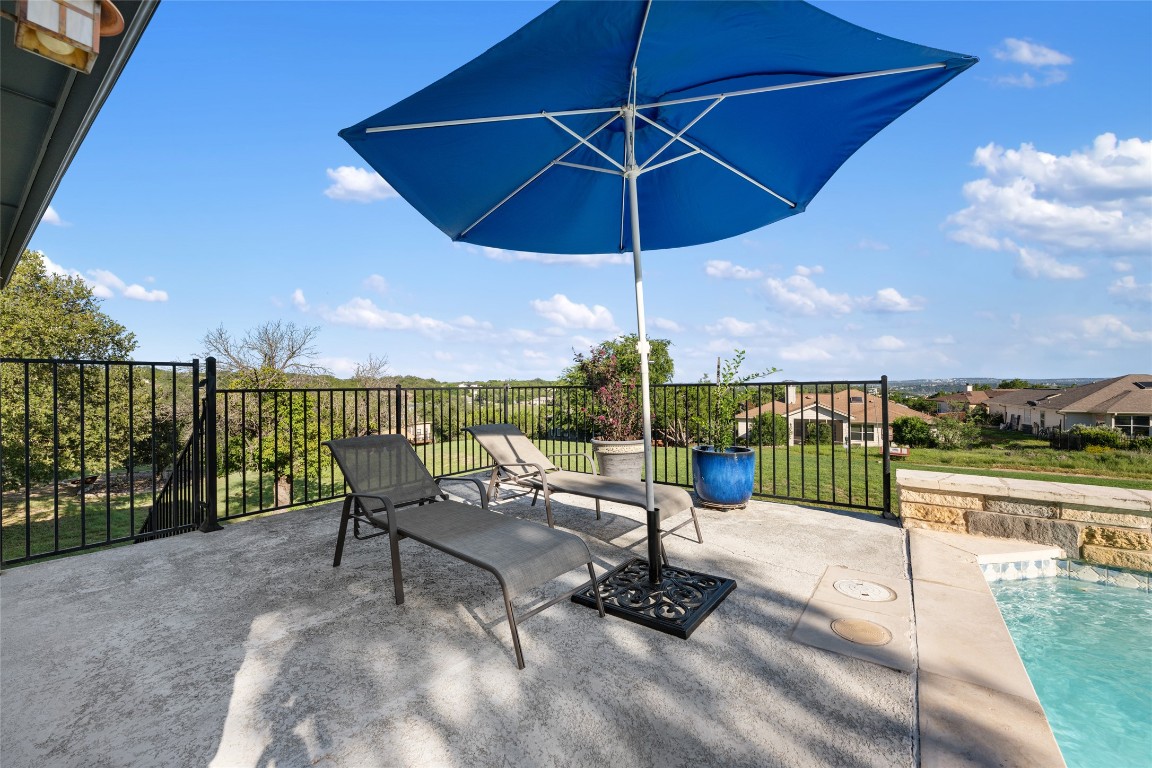 20403 Highland Lake Drive Lago Vista, TX 78645 - Photo 34 of 40 a view of a terrace with furniture and umbrella