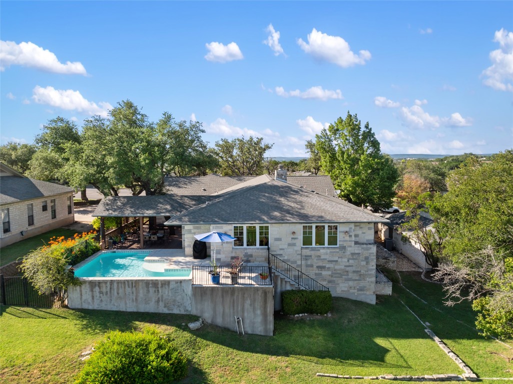 20403 Highland Lake Drive Lago Vista, TX 78645 - Photo 35 of 40 a view of a house with swimming pool and sitting area