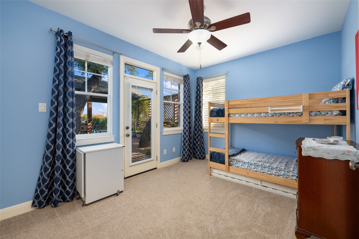 20403 Highland Lake Drive Lago Vista, TX 78645 - Photo 7 of 40 a bed room with a bed and a window