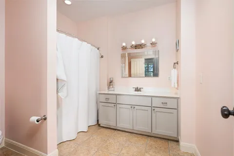a kitchen with granite countertop a sink and wooden floor