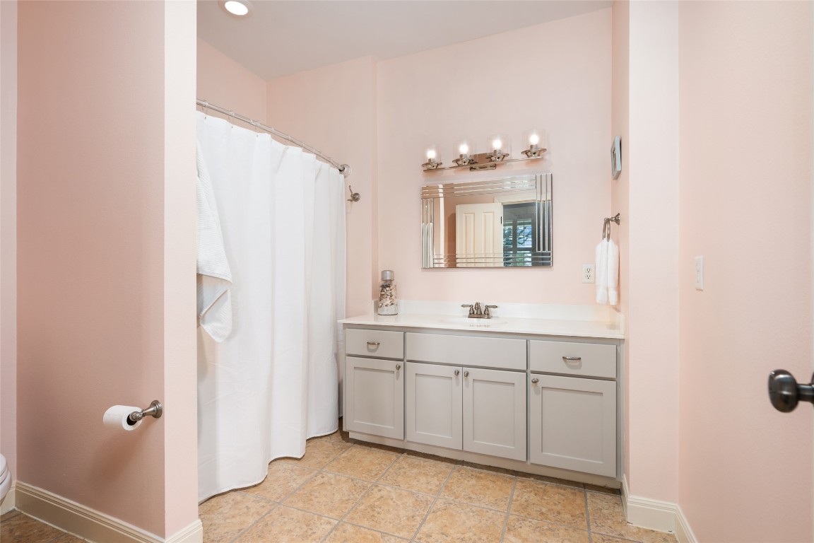 20403 Highland Lake Drive Lago Vista, TX 78645 - Photo 9 of 40 a bathroom with a double vanity sink mirror and double