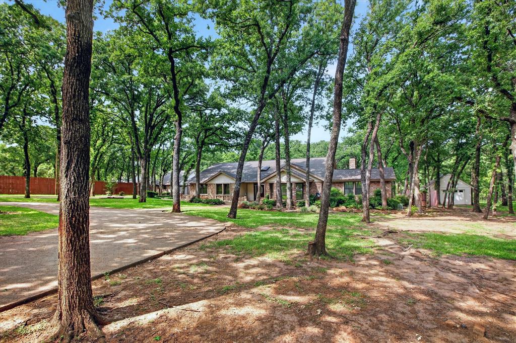 1607 North Main Street Euless, TX 76039 - Photo 3 of 39 a view of a park with large trees