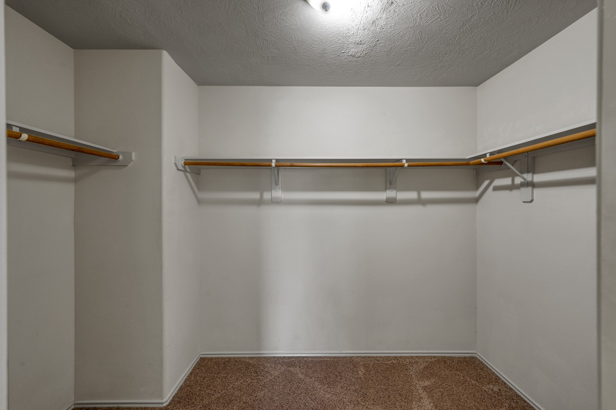 23919 Kingbriar Drive Spring, TX 77373 - Photo 27 of 33 The spacious walk-in closet offers ample storage with plenty of hanging space to keep everything organized.