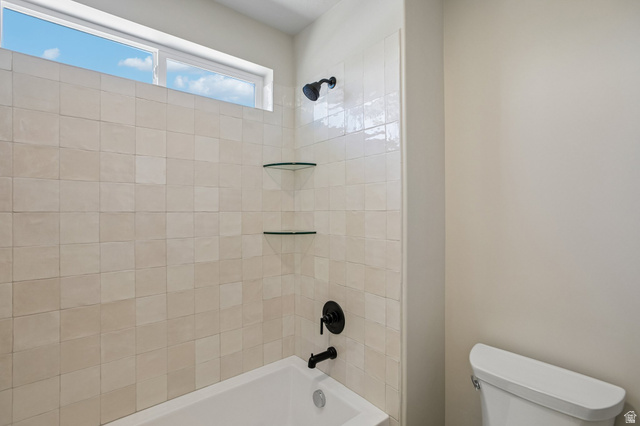 11781 South Halls Crk Road Draper, UT 84020 - Photo 27 of 33 Bathtub and shower combination featuring floor-to-ceiling square tile surround
