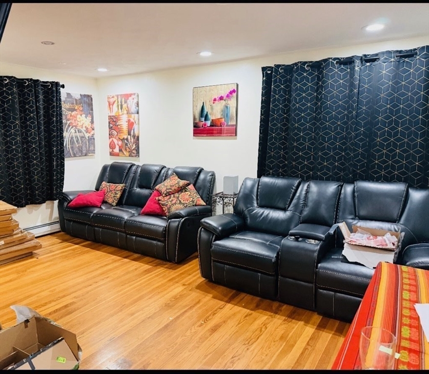 41 Shurtleff Street Revere, MA 02151 - Photo 2 of 12 a living room with furniture window and a flat screen tv