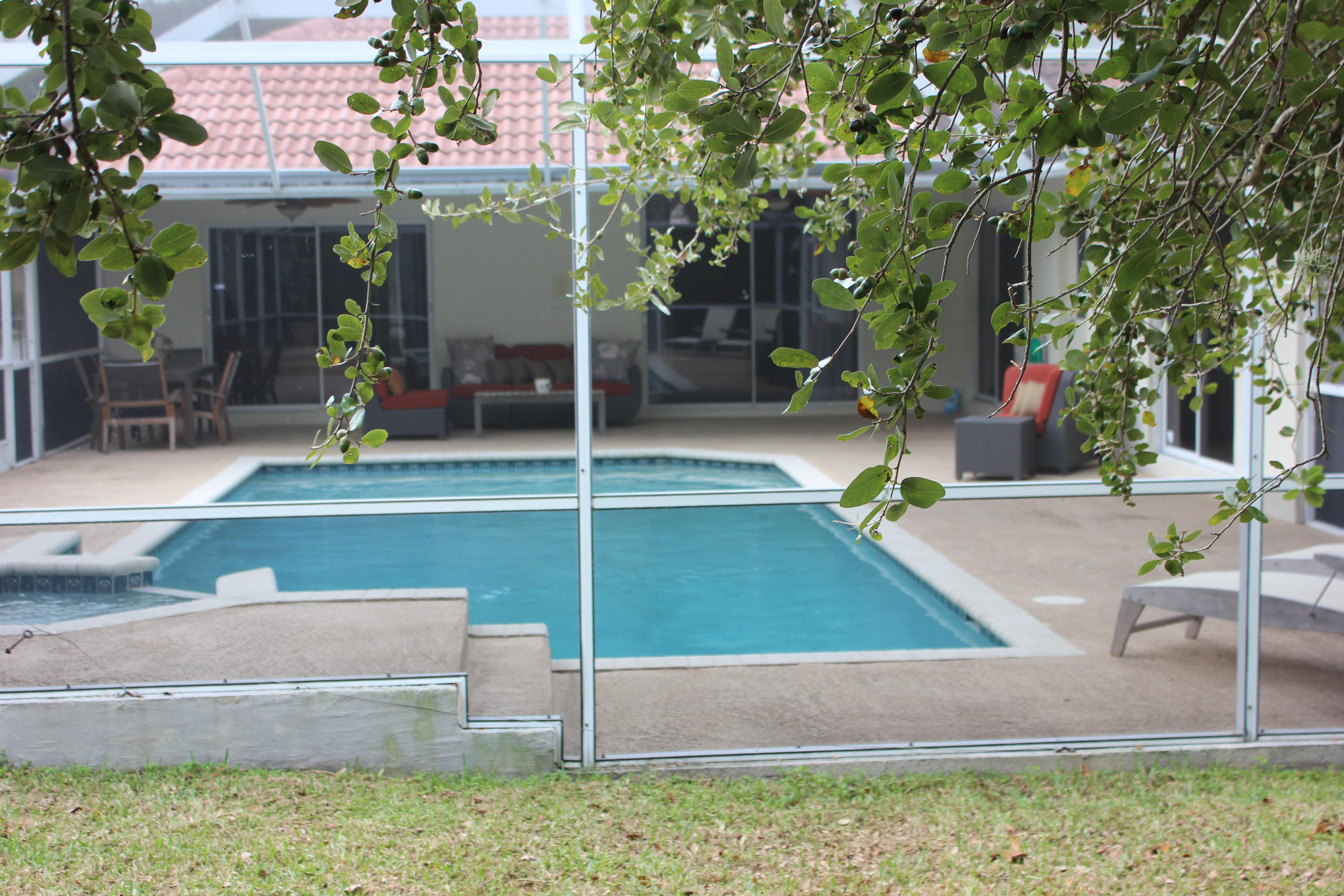2671 Northwest 49th Street Boca Raton, FL 33434 - Photo 11 of 47 a view of a house with a yard and sitting area