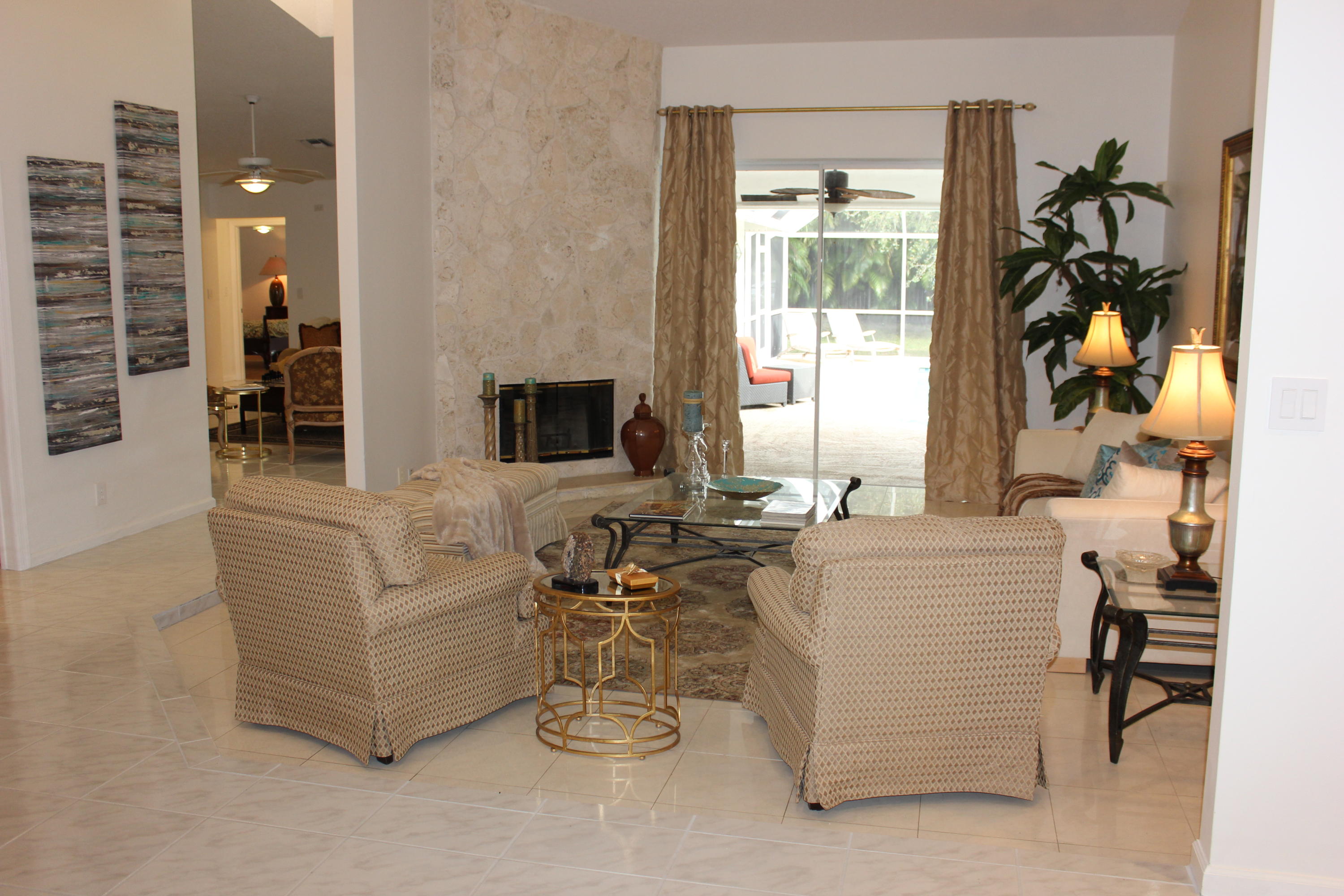2671 Northwest 49th Street Boca Raton, FL 33434 - Photo 14 of 47 a living room with furniture and a large window