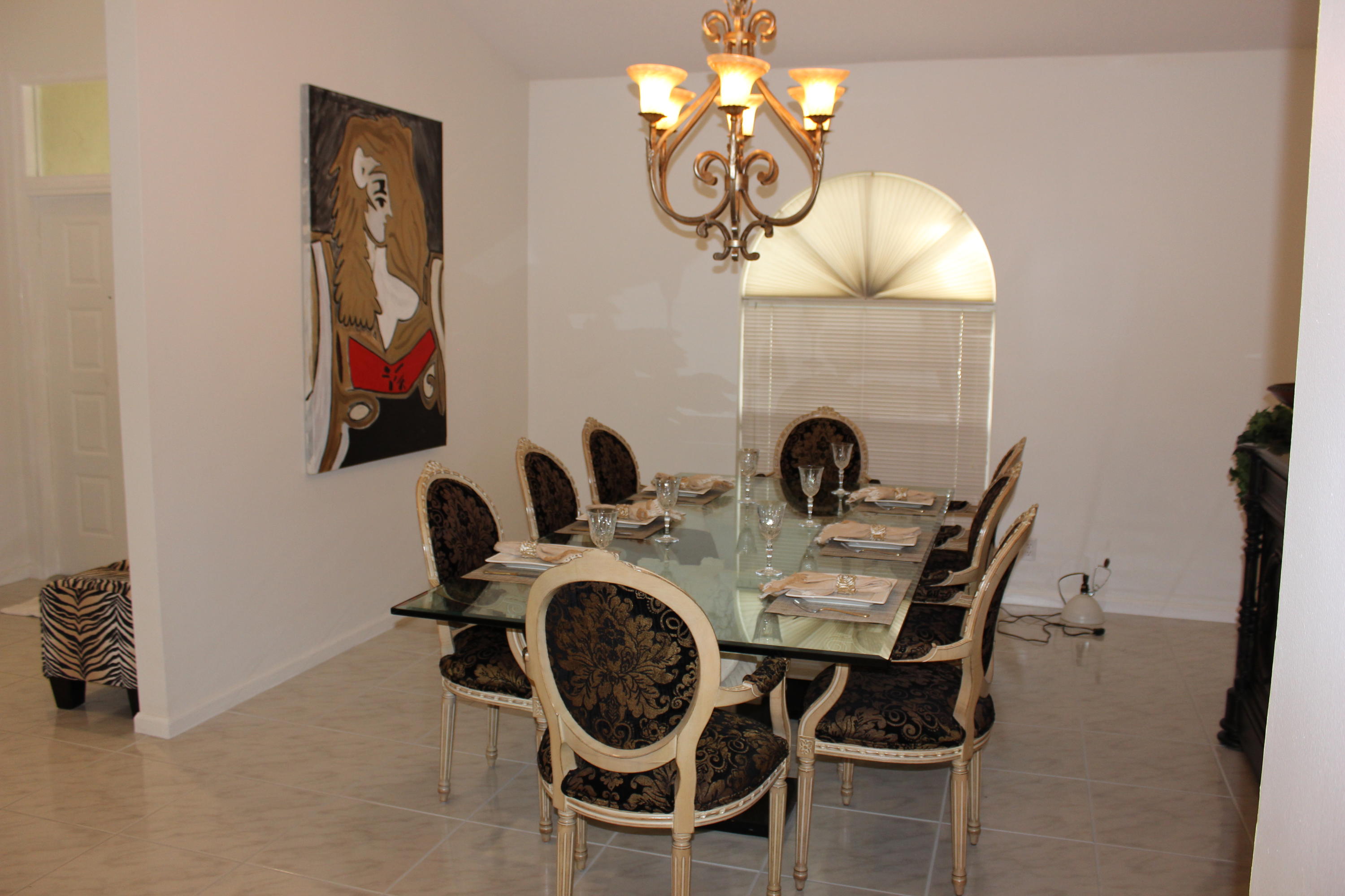 2671 Northwest 49th Street Boca Raton, FL 33434 - Photo 16 of 47 a view of a dining room with furniture and chandelier