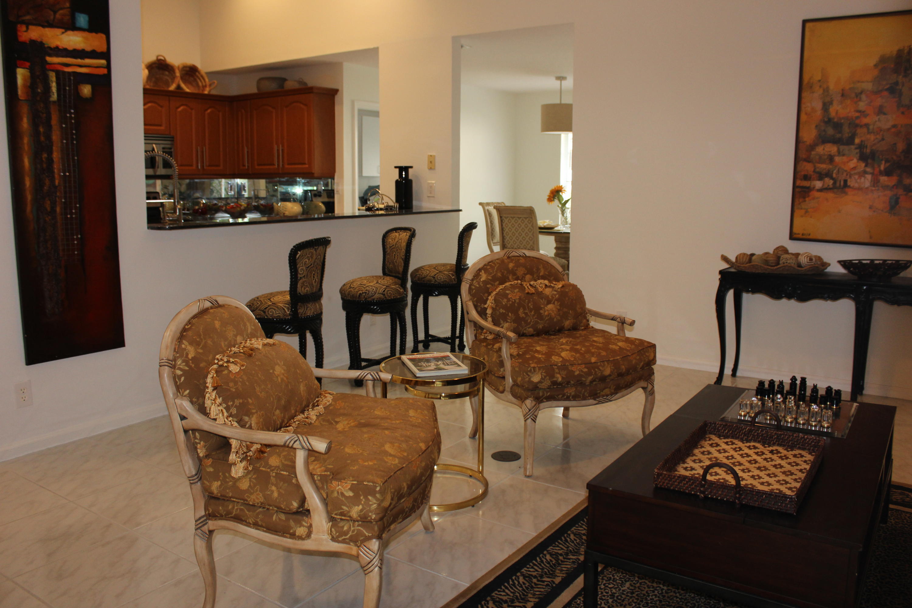 2671 Northwest 49th Street Boca Raton, FL 33434 - Photo 26 of 47 a living room with furniture and a flat screen tv