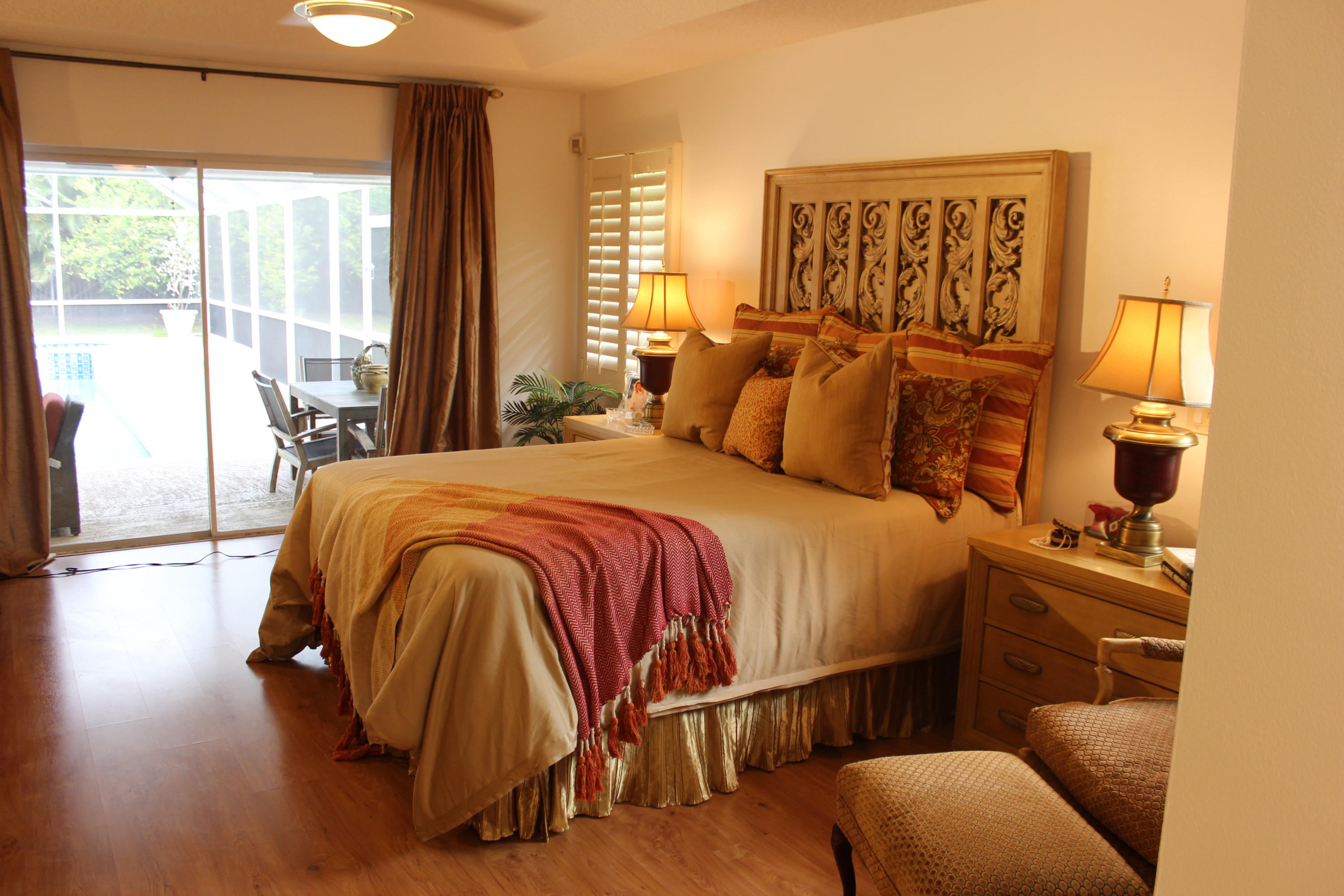 2671 Northwest 49th Street Boca Raton, FL 33434 - Photo 27 of 47 a bed sitting in a bedroom next to a window