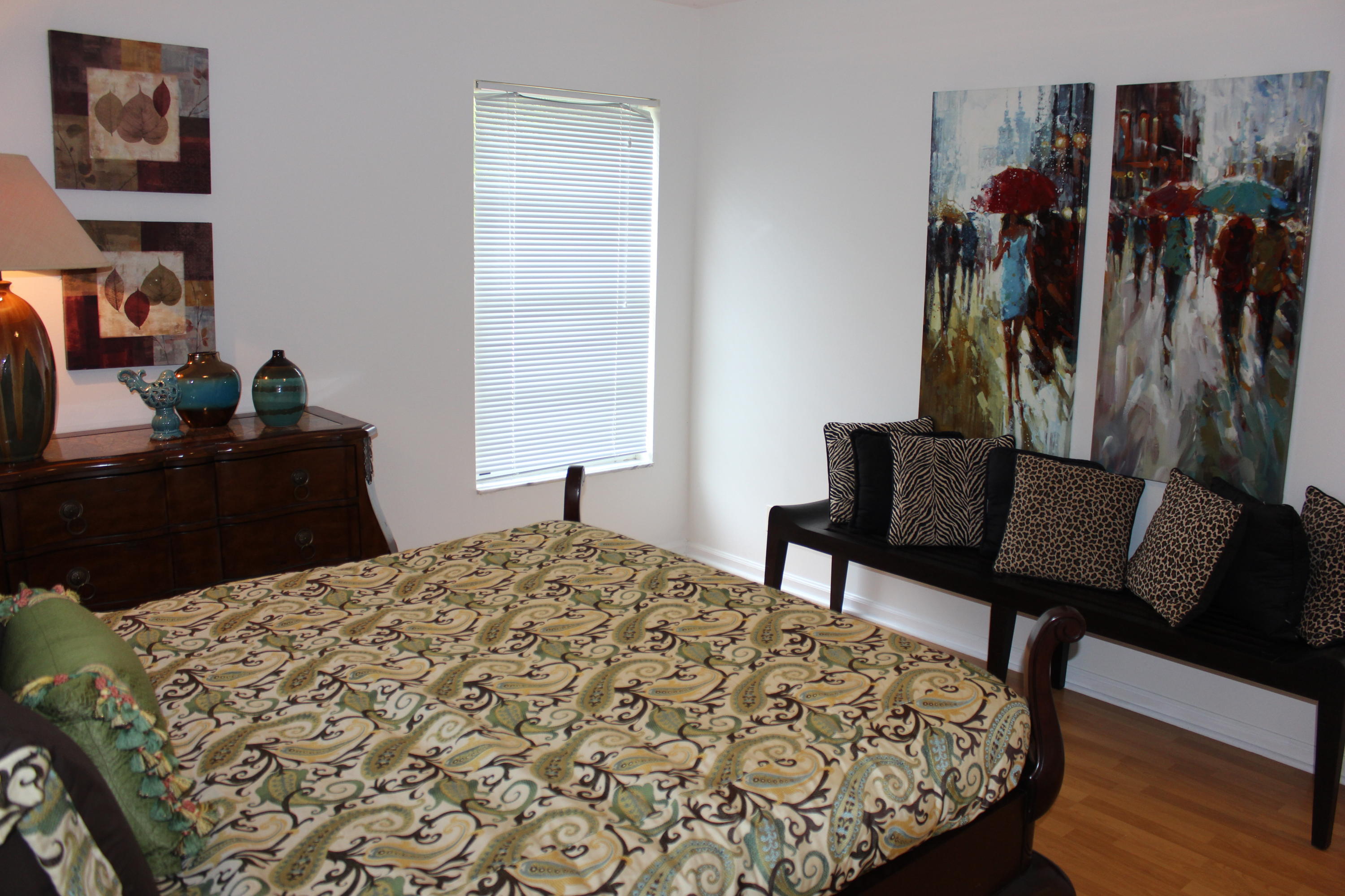 2671 Northwest 49th Street Boca Raton, FL 33434 - Photo 34 of 47 a bed room with a bed and a chair