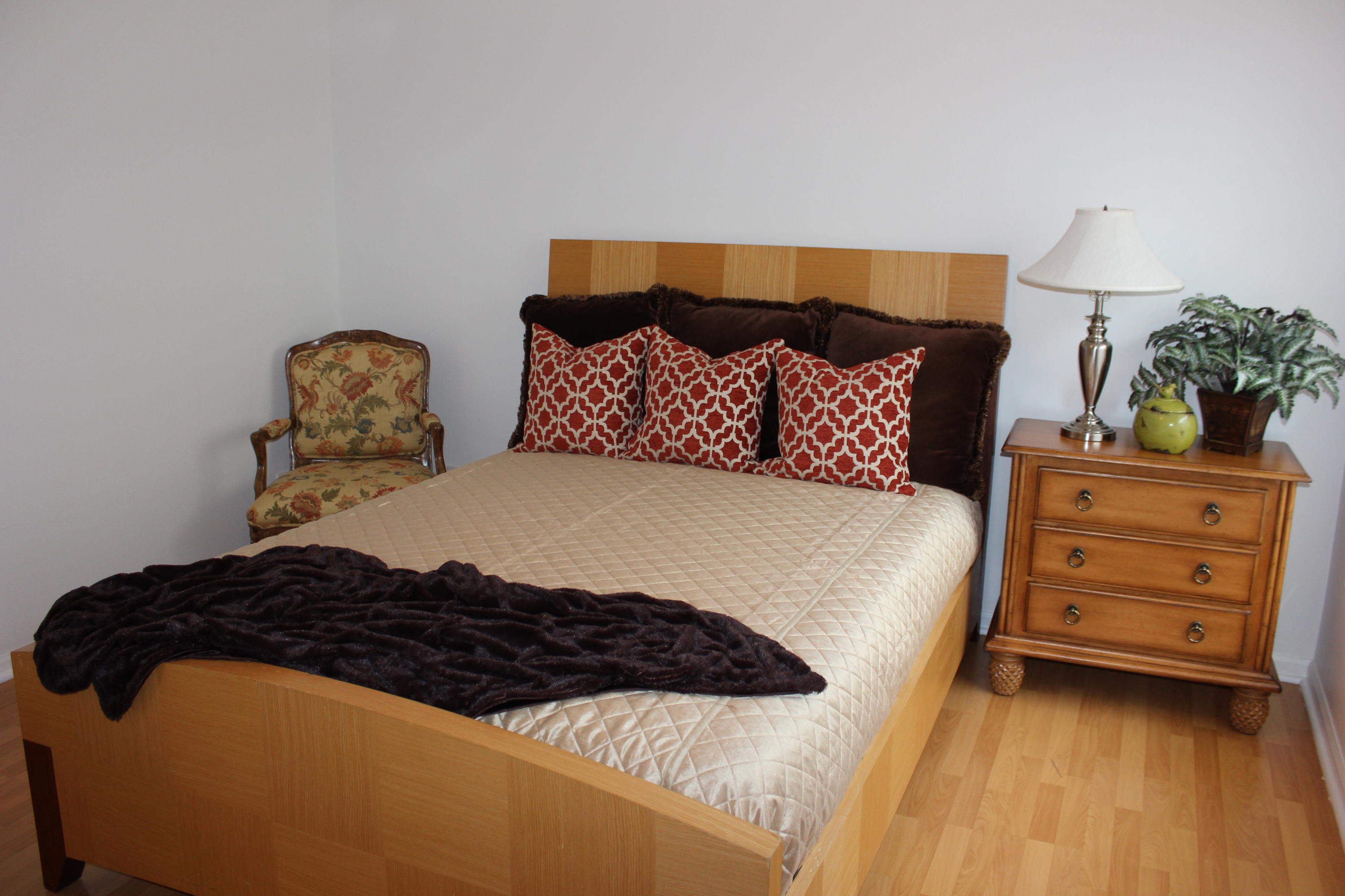 2671 Northwest 49th Street Boca Raton, FL 33434 - Photo 35 of 47 a large bed sitting in a bedroom next to a lamp