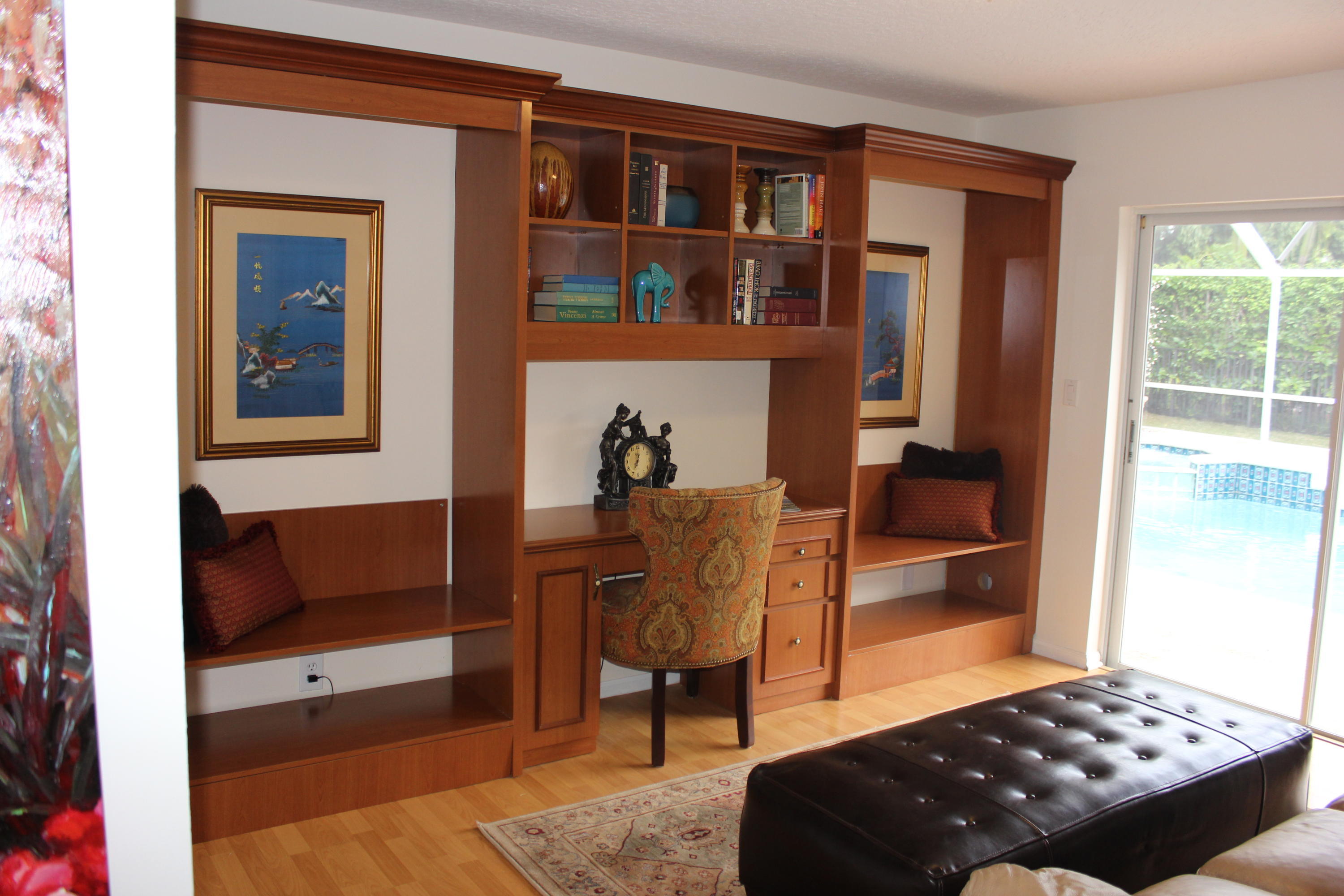 2671 Northwest 49th Street Boca Raton, FL 33434 - Photo 41 of 47 a living room with furniture a rug and a window