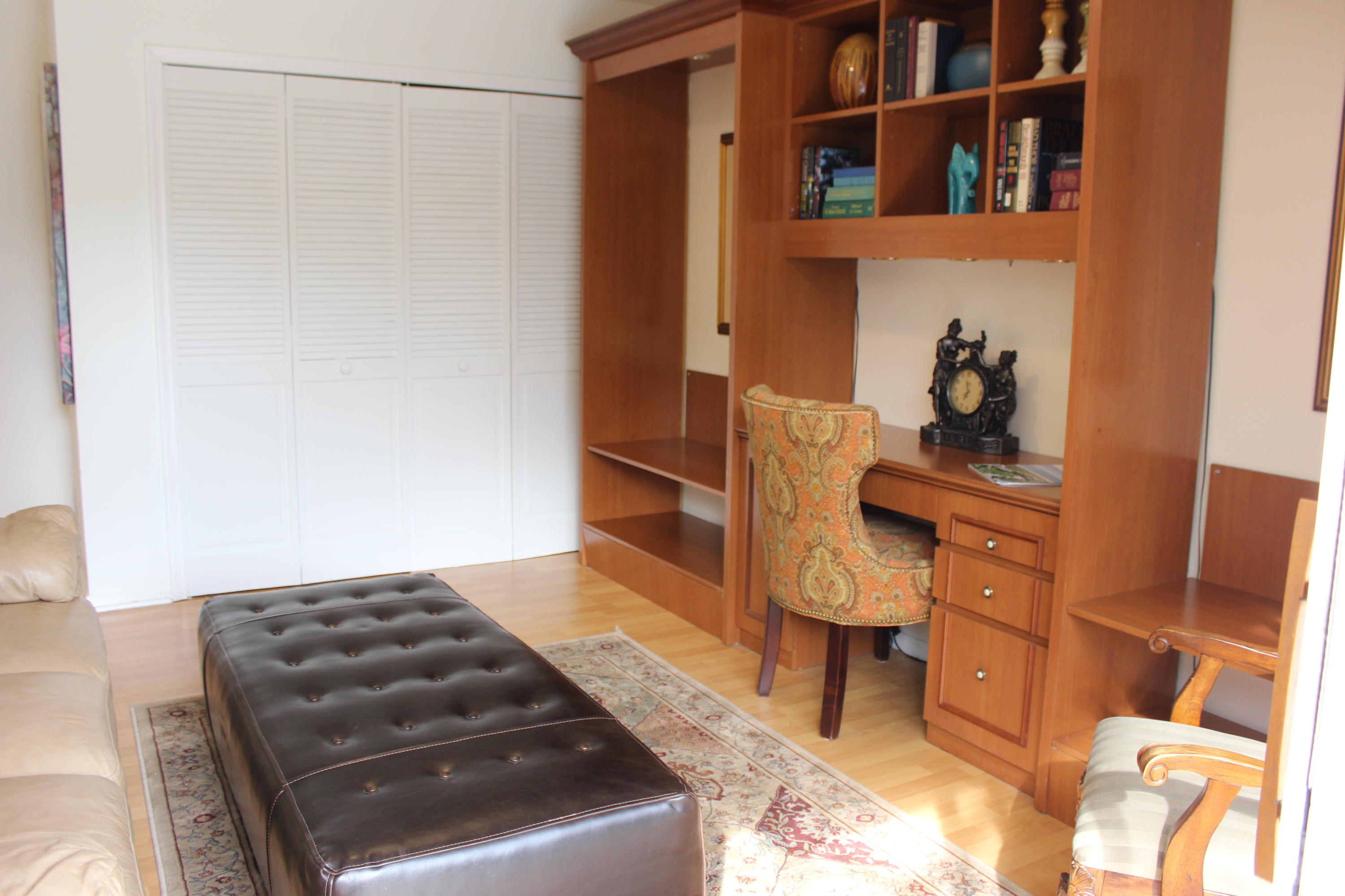 2671 Northwest 49th Street Boca Raton, FL 33434 - Photo 42 of 47 a bedroom with a bed and a cabinets
