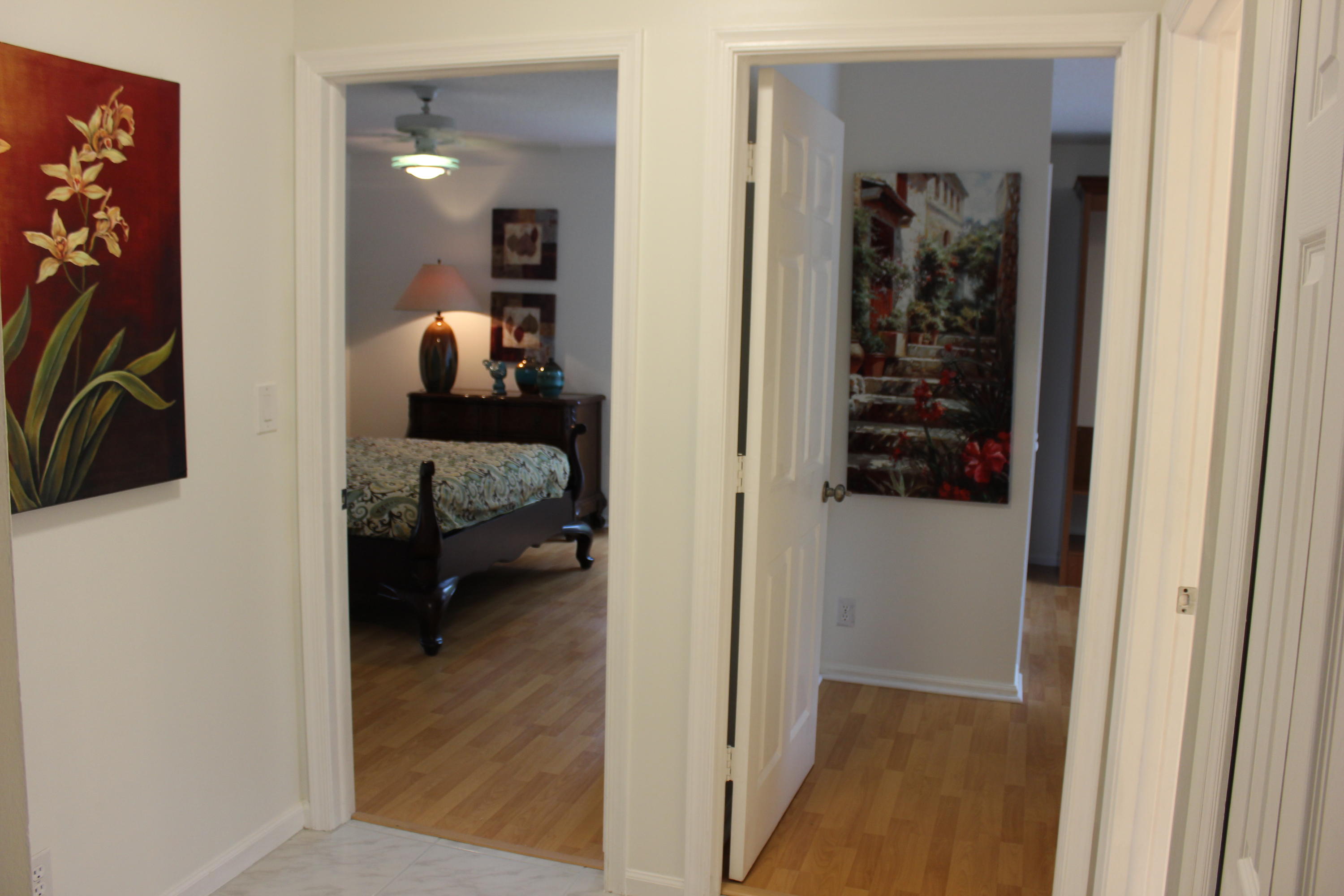 2671 Northwest 49th Street Boca Raton, FL 33434 - Photo 46 of 47 a view of a bedroom from a hallway