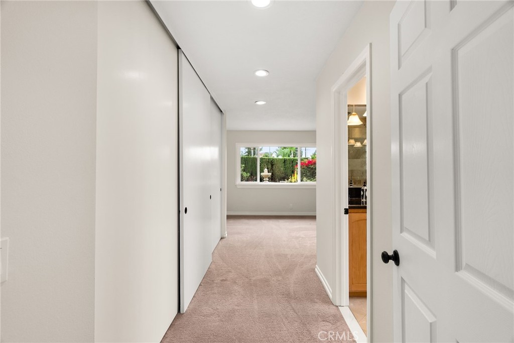 1902 East Eucalyptus Lane Brea, CA 92821 - Photo 15 of 41 a view of a hallway with wooden floor and a bathroom