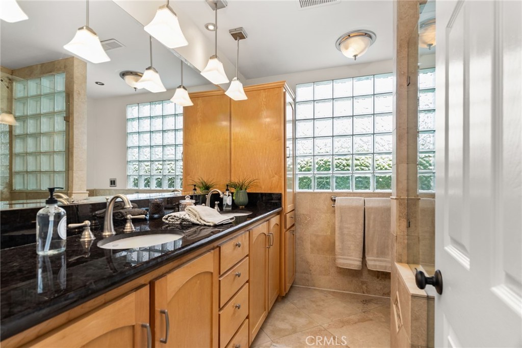 1902 East Eucalyptus Lane Brea, CA 92821 - Photo 19 of 41 a kitchen with large windows and chandelier