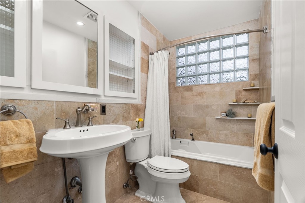 1902 East Eucalyptus Lane Brea, CA 92821 - Photo 24 of 41 a bathroom with a sink a toilet and shower