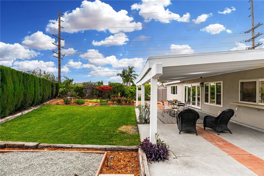 1902 East Eucalyptus Lane Brea, CA 92821 - Photo 32 of 41 a view of a patio with couches chairs potted plants and a big yard