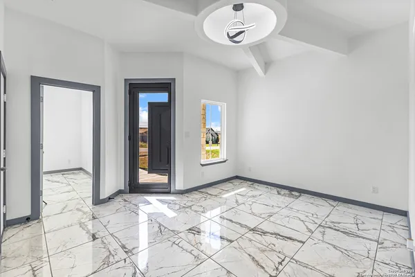 a view of an empty room and window