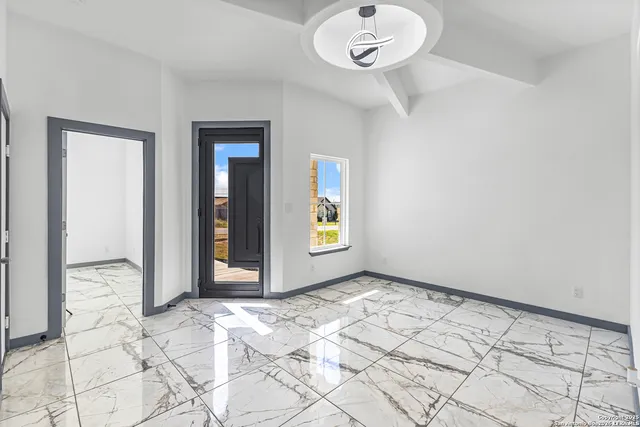 a view of an empty room and window