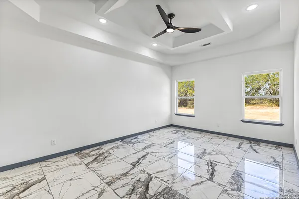 a spacious bathroom with a shower and a sink