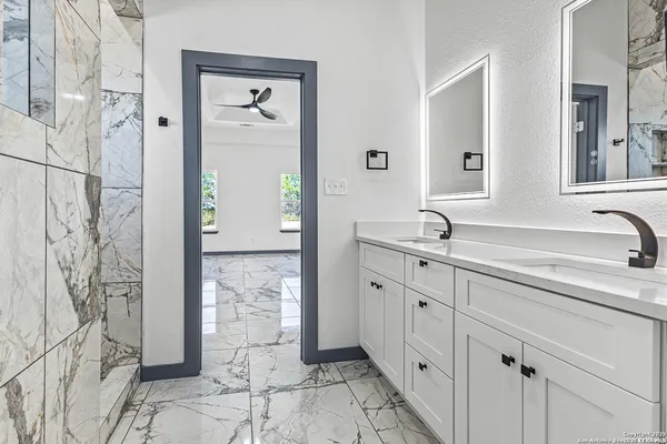 a bathroom with a bathtub and shower