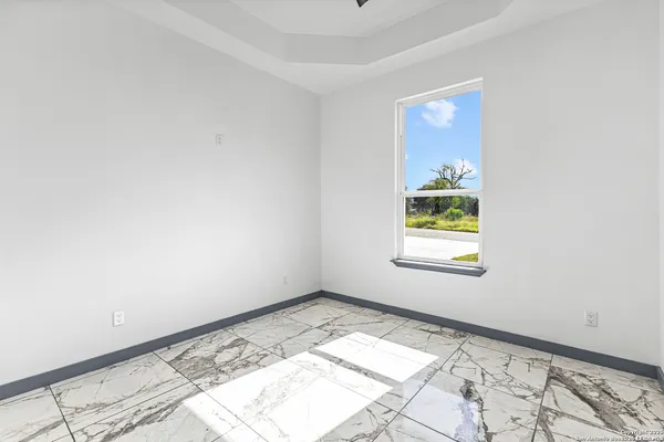a bathroom with a granite countertop toilet sink and shower