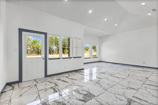 a view of an empty room and window
