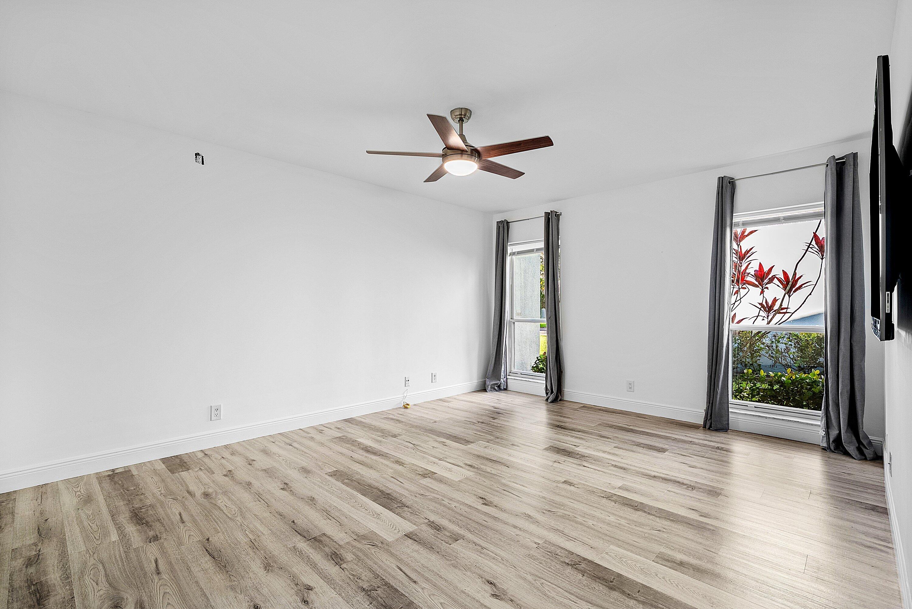 6165 Old Court Road, Unit 123 Boca Raton, FL 33433 - Photo 13 of 30 wooden floor in an empty room with a window
