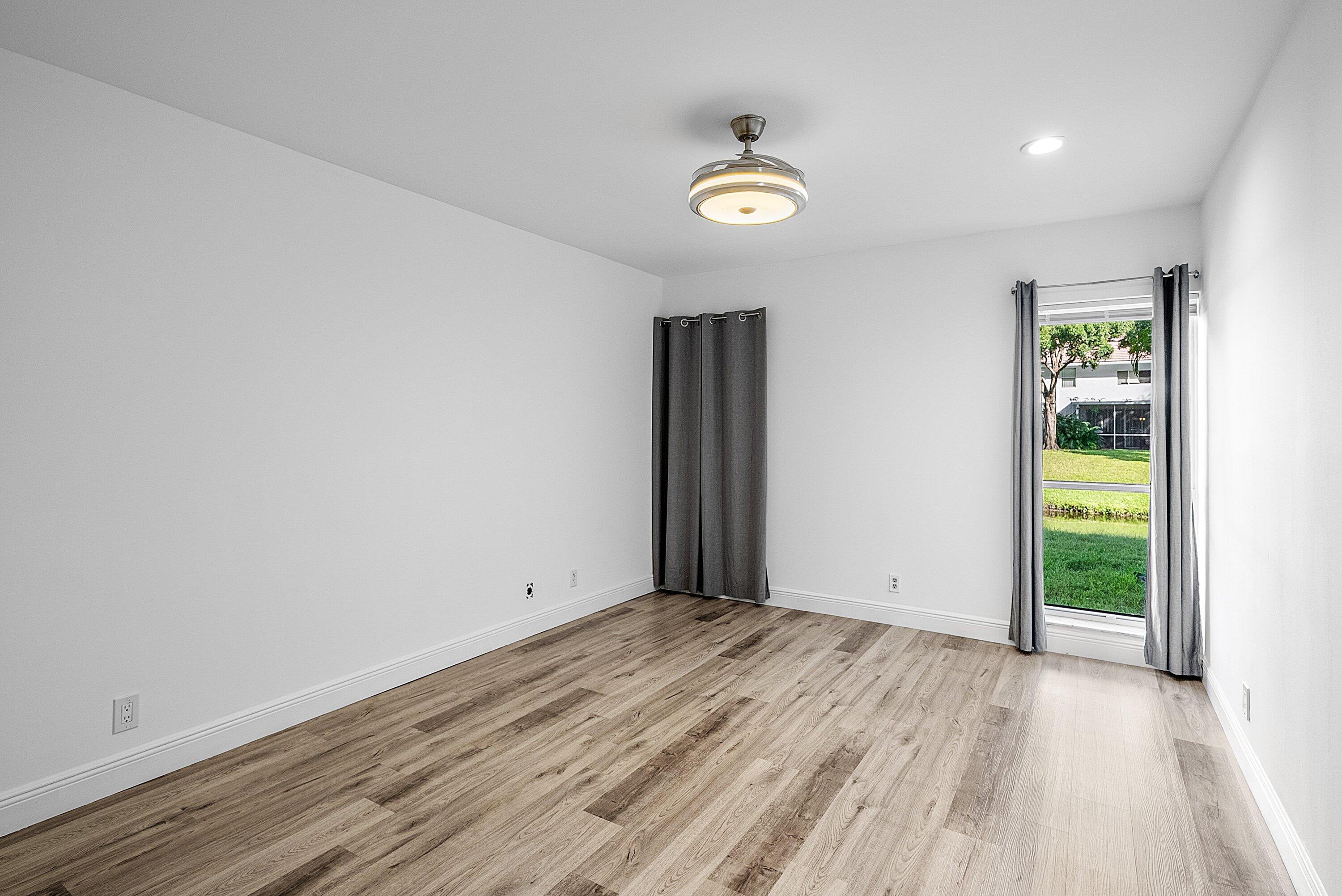 6165 Old Court Road, Unit 123 Boca Raton, FL 33433 - Photo 19 of 30 an empty room with closet and windows