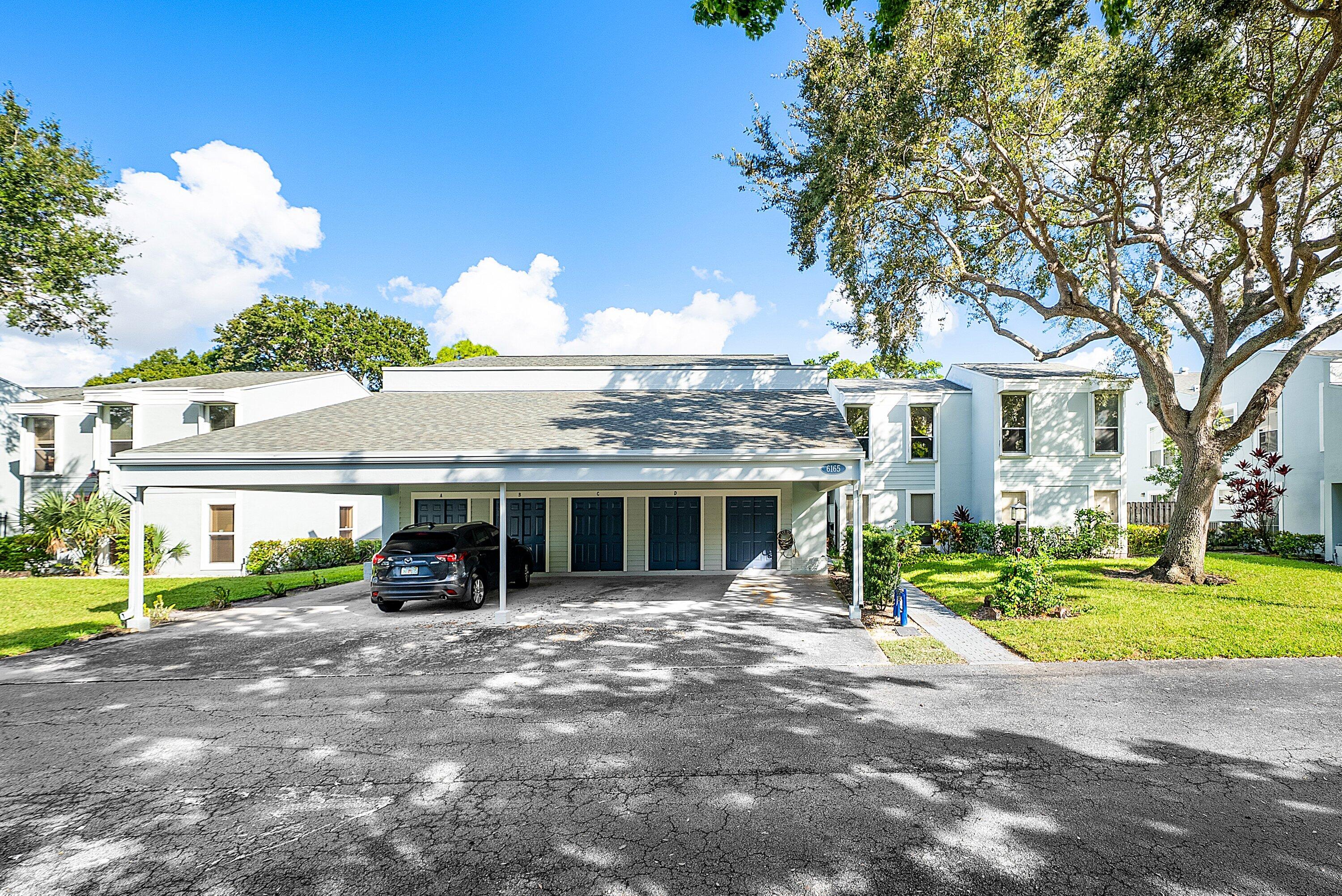 6165 Old Court Road, Unit 123 Boca Raton, FL 33433 - Photo 30 of 30 a view of outdoor space with garden and trees