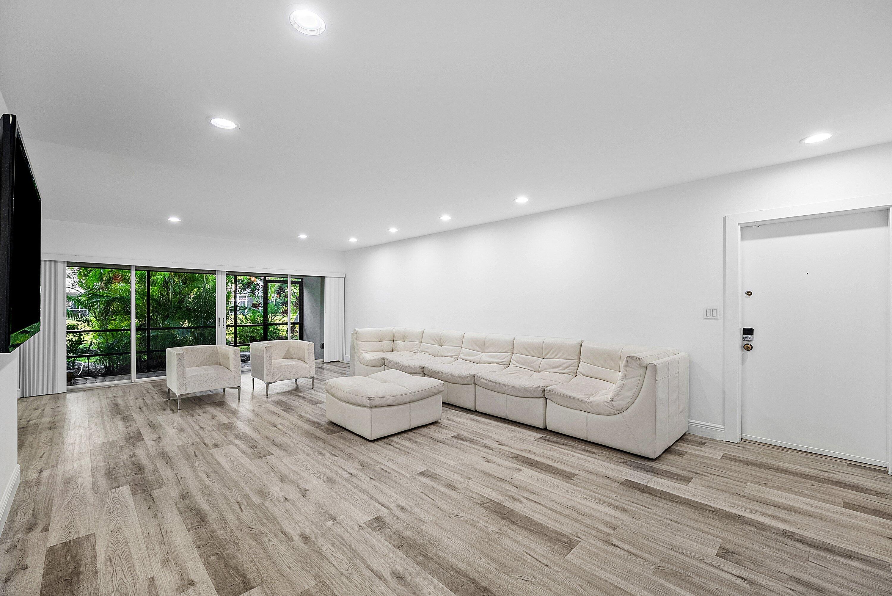 6165 Old Court Road, Unit 123 Boca Raton, FL 33433 - Photo 7 of 30 a living room with furniture and large windows