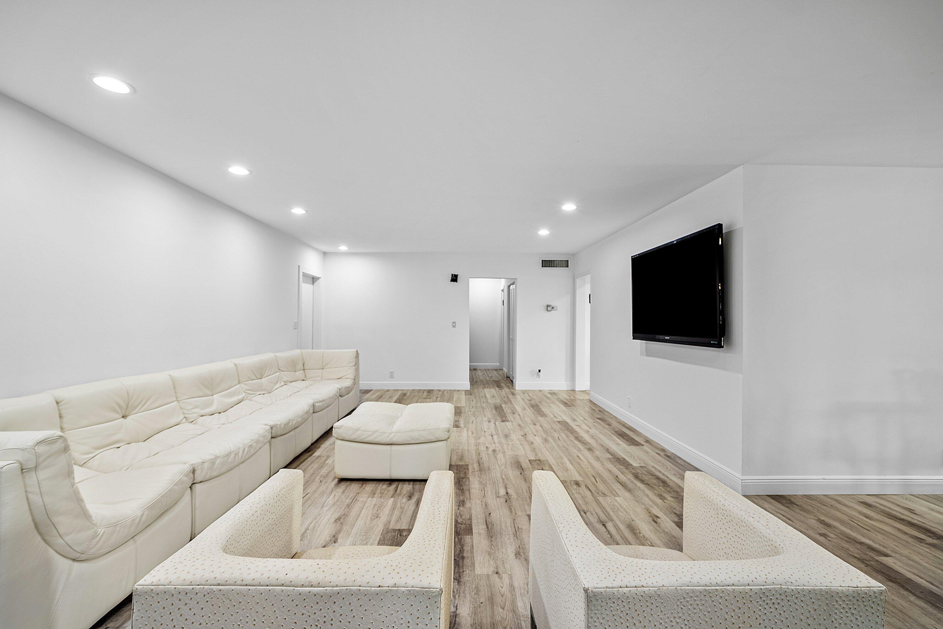 6165 Old Court Road, Unit 123 Boca Raton, FL 33433 - Photo 8 of 30 a living room with furniture and a flat screen tv