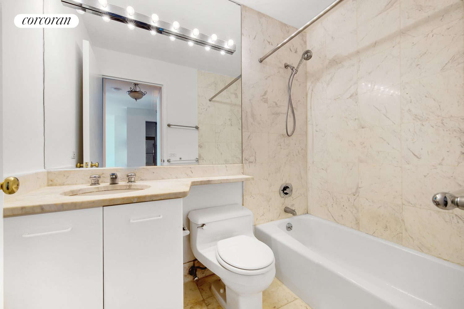 2373 Broadway, Unit 705 Manhattan, NY 10024 - Photo 6 of 13 a bathroom with a double vanity sink toilet mirror and bathtub