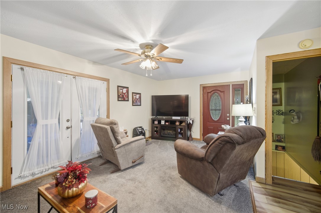 1788 Ashby Ridge Road Parkersburg, WV 26104 - Photo 12 of 46 Living area with a ceiling fan and carpet floors