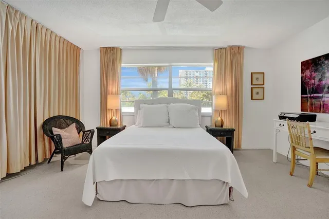 a bedroom with a bed and a table in it