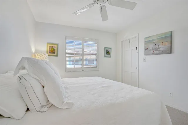 a spacious bedroom with a bed and a couch