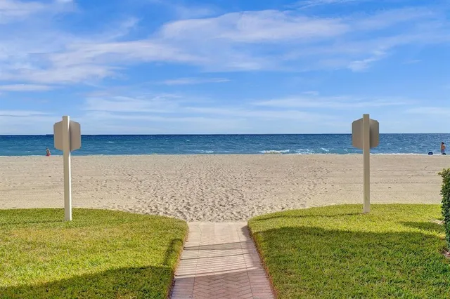a view of a lake with a big yard