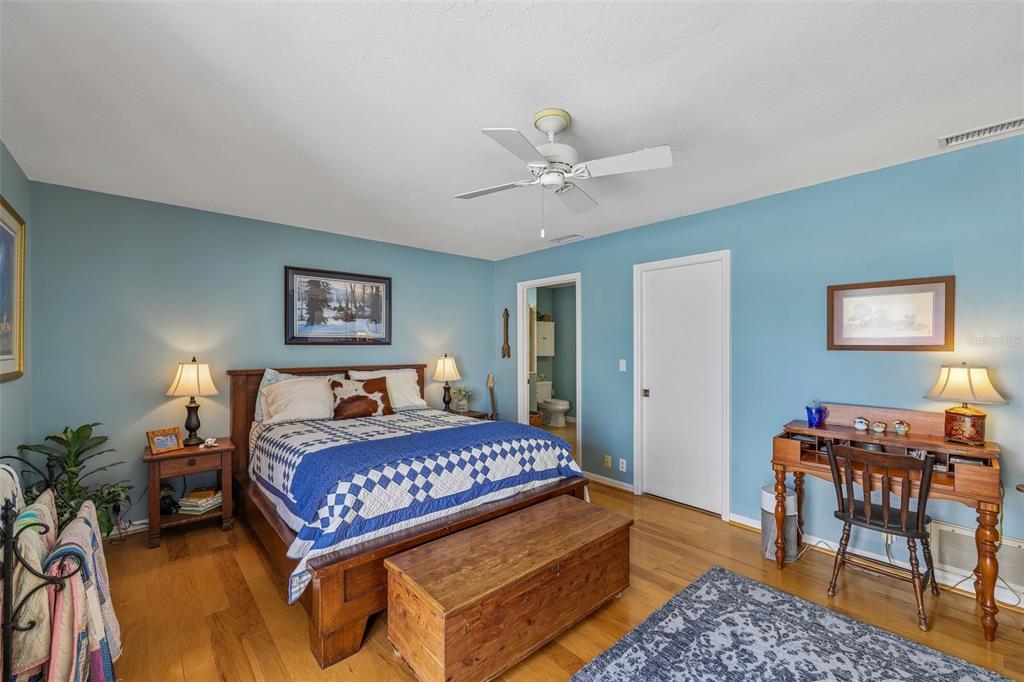 3757 Countryside Road Sarasota, FL 34233 - Photo 14 of 34 a bedroom with a bed a table and chair