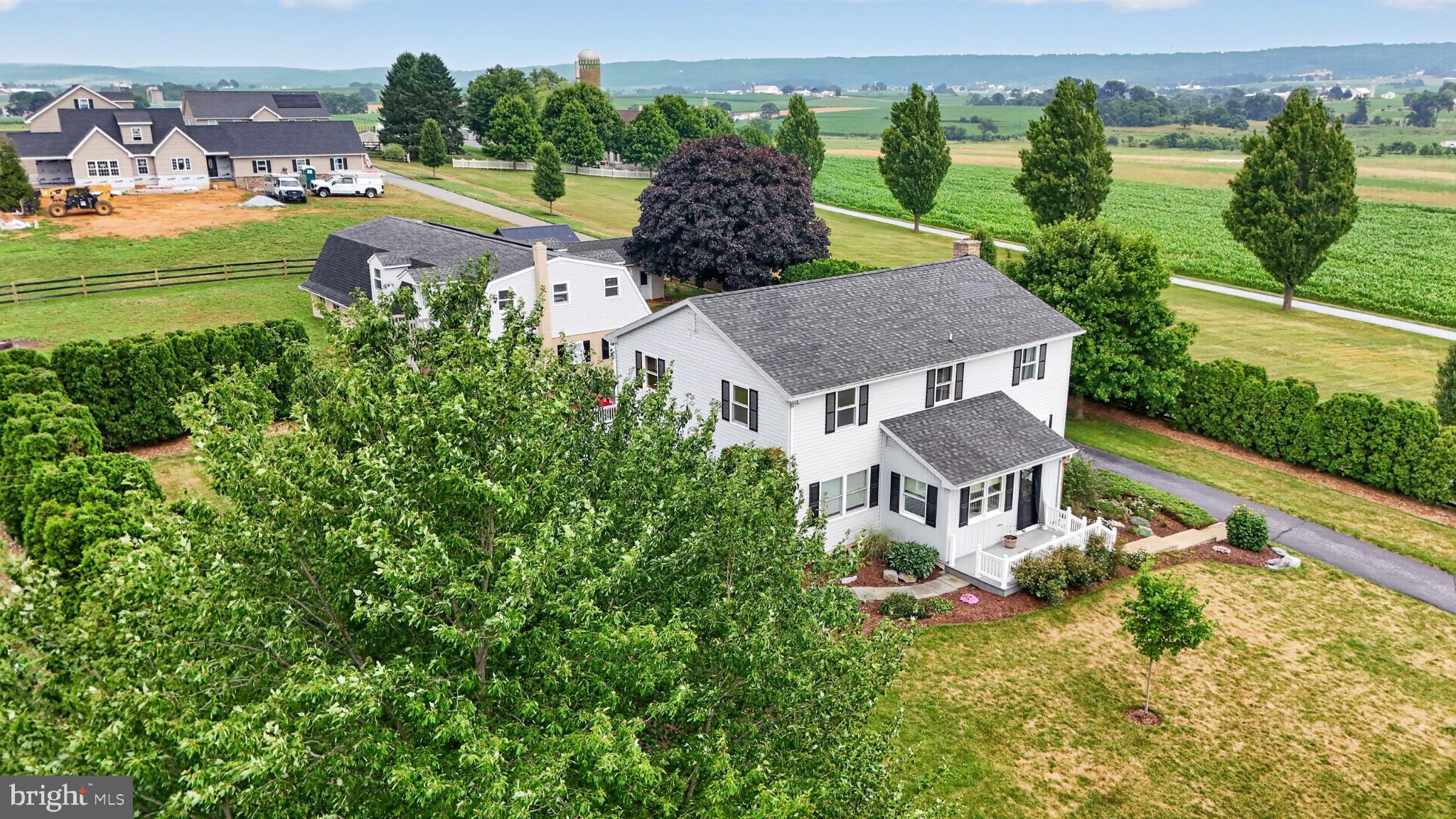 285 School Lane Road Gap, PA 17527 - Photo 10 of 56 Charming home amidst lush greenery.